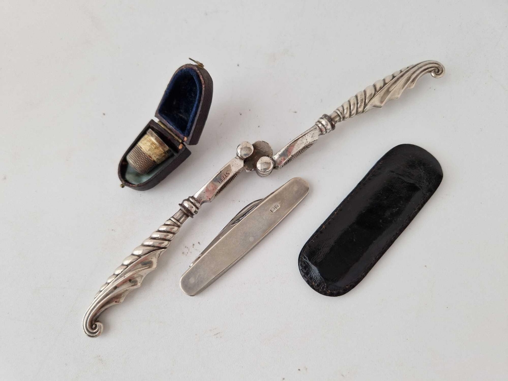 A pair of silver handled nut crackers, a cased thimble and a silver sided two blade knife by EV - Image 2 of 2