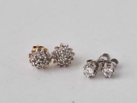 A pair of diamond stud 9ct white gold earrings & a pair of cluster earrings