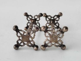 A pair of Victorian knife rests with pierced ends, London 1841 by JE, 66 g