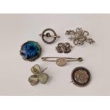 A quantity of assorted silver and other brooches