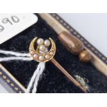 A gold and pearl crescent stick pin, boxed 1.4 g