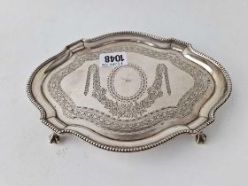 A small Victorian card tray with beaded rim and bright cut decoration, 8 inches wide, London 1874 by