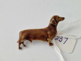 A silver and enamel Kenart brooch of a dachshund