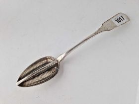 A colonial strainer spoon