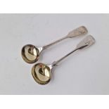A pair of Victorian fiddle pattern salt spoons, gilt bowls, London 1875 by HH, 29 g