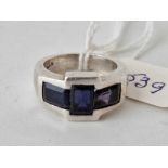 A silver deco style ring with three blue stones size N 9.8g