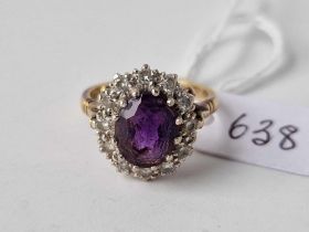 AN AMETHYST AND DIAMOND CLUSTER RING, 18ct, size N, 6.3 g