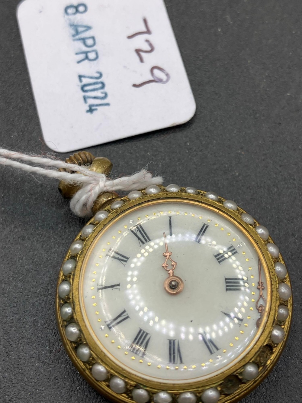 A pearl mounted fob watch watch EDWARD the 7th portrait to rear cracked glass