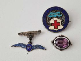 A silver and amethyst brooch a silver RAF brooch and badge