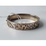 An antique silver and gold hinged bangle with full Chester hallmarks 21.4g