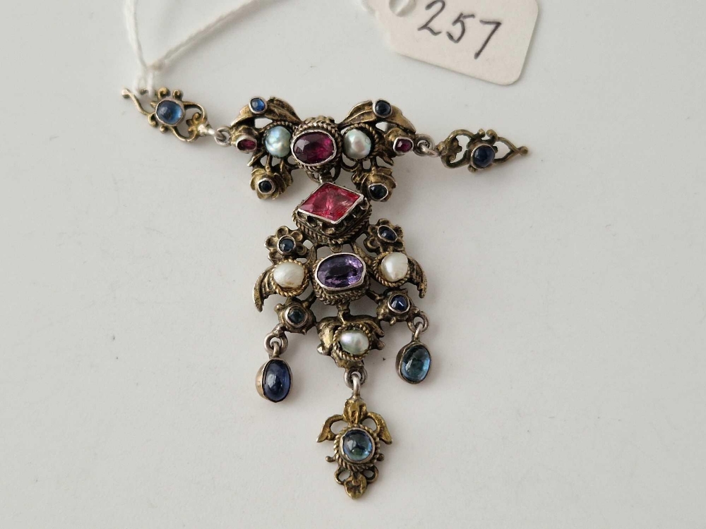 A 19thc Austro Hungarian silver gilt brooch set with pearls amethysts garnets & sapphires - Image 2 of 3