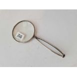 A folding silver mounted magnifying glass, 4" diameter