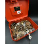 Cash tin of foreign coins