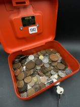 Cash tin of foreign coins