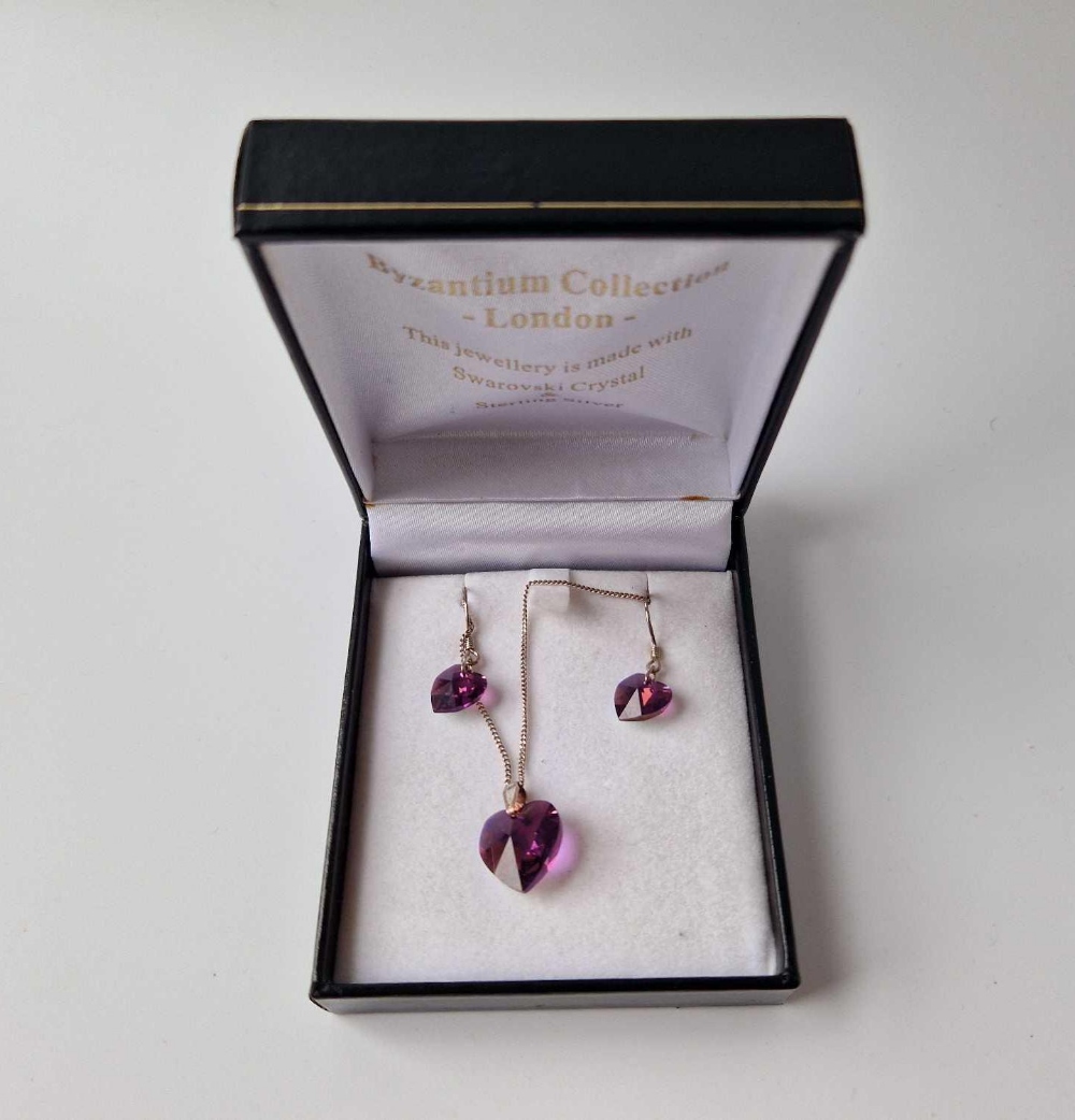 A boxed silver and Swarovski necklace and earrings