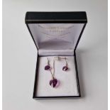 A boxed silver and Swarovski necklace and earrings