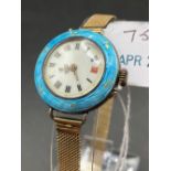 A LADIES SILVER BLUE ENAMEL WRIST WATCH WITH 9CT GOLD FANCY STRAP APPROX 9 GMS