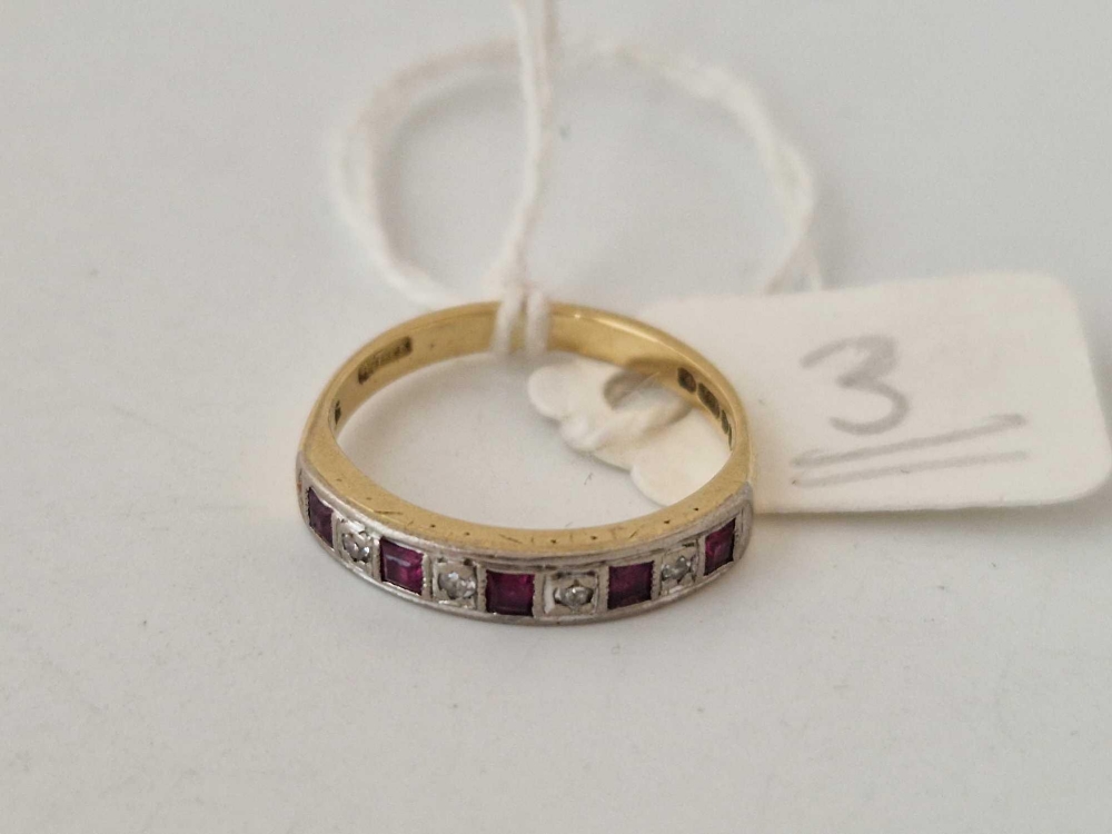 A nine stone ruby and diamond half eternity ring, 18ct, size I