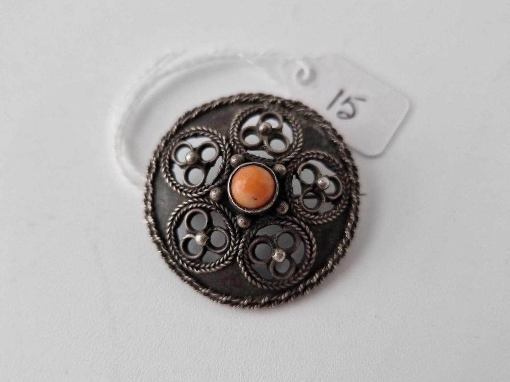 Antique Arts and crafts circular brooch with Celtic design, set with a central coral