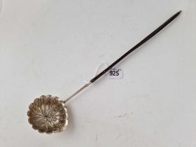 A 19th Century toddy ladle with fluted bowl, whale bone handle unmarked