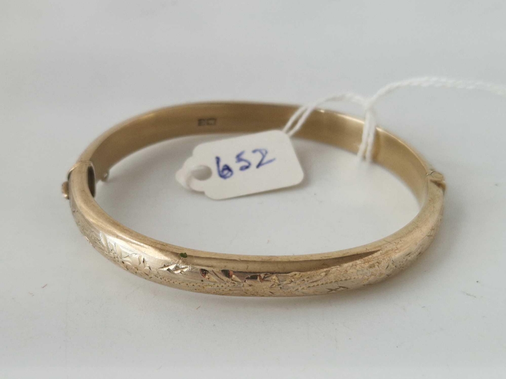 A silver gilt hinged bangle