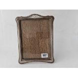 Another photo frame with shaped oblong border, 9" high, Birmingham 1921 by GF & Co