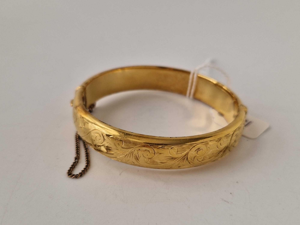 A rolled gold bangle