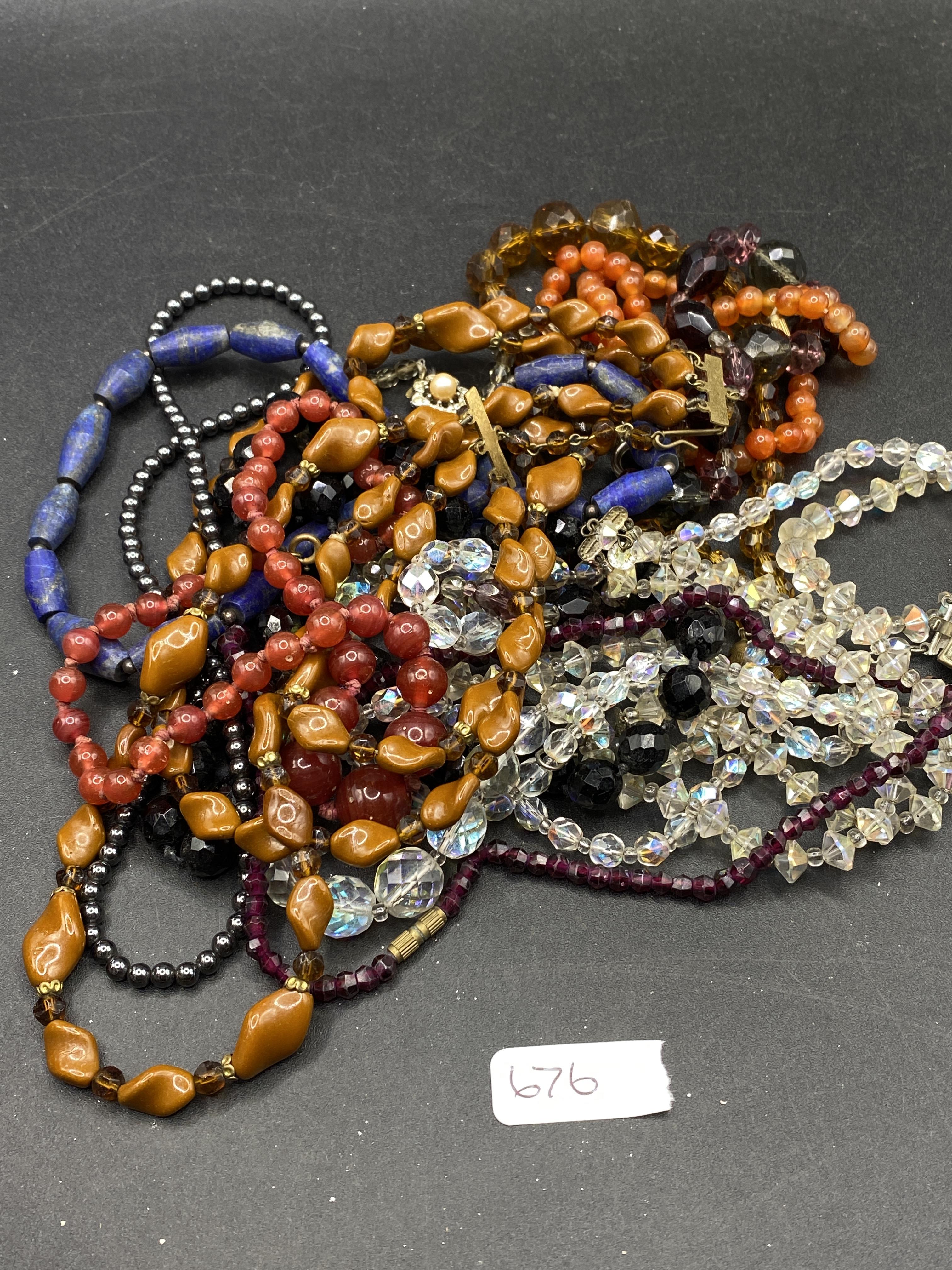 A bag of assorted costume jewellery