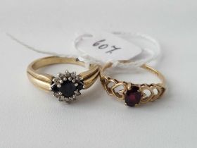 A sapphire and diamond ring and a garnet ring size N and O 5 gms inc.