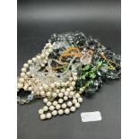 A bag of assorted costume jewellery