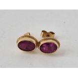 A pair of garnet set earrings, 9ct