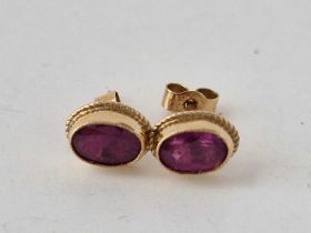 A pair of garnet set earrings, 9ct