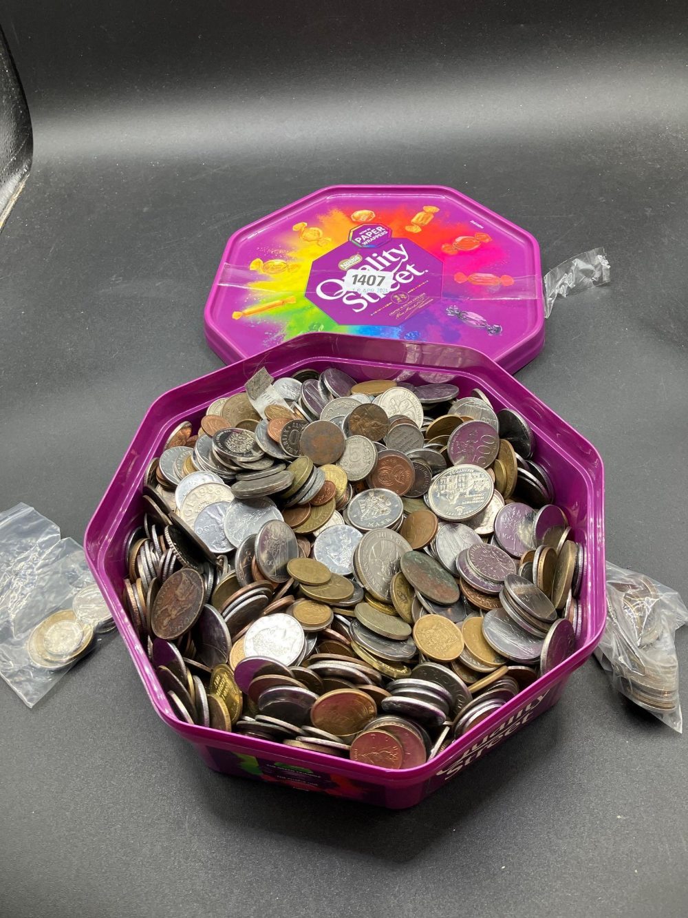 Heavy tub of world coins