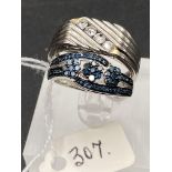 Two silver and diamond rings blue diamond and signet ring