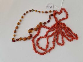 A twig coral necklace and an amber example