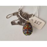 An early 20thc silver gilt & enamel egg pendant on silver chain 26”