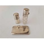 A card case of curved outline and two mounted salts bottles