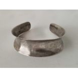 A silver half torque bangle 23.6g