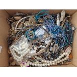 A very large and heavy box of costume jewellery