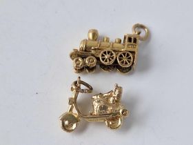 Two vintage 9ct charms a locomotive and a scooter 8.1g