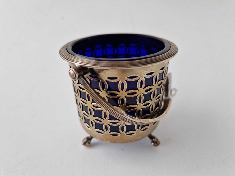 An Edwardian circular basket with pierced sides and claw and ball feet, swing handle, 3" wide, - Image 2 of 2