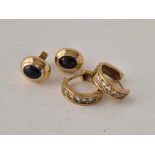 A pair of diamond earrings and a pair of sapphire earrings both 9ct