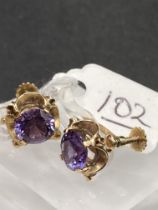 A pair of screw back gem set 9ct earrings 3.6g inc