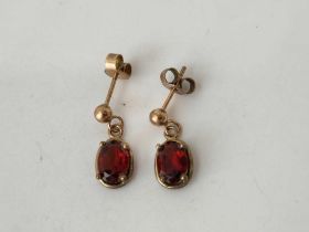 A pair of 9ct and red stone earrings 1.2g