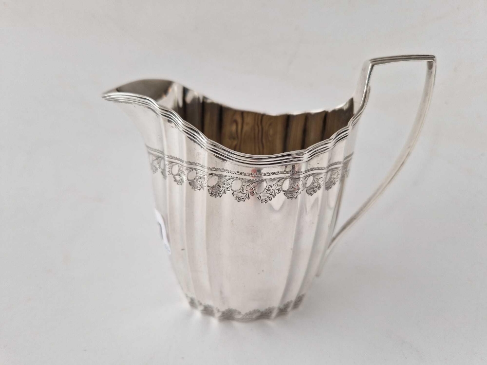 A George III cream jug with ribbed body, London 1797 by WS, 173 g.