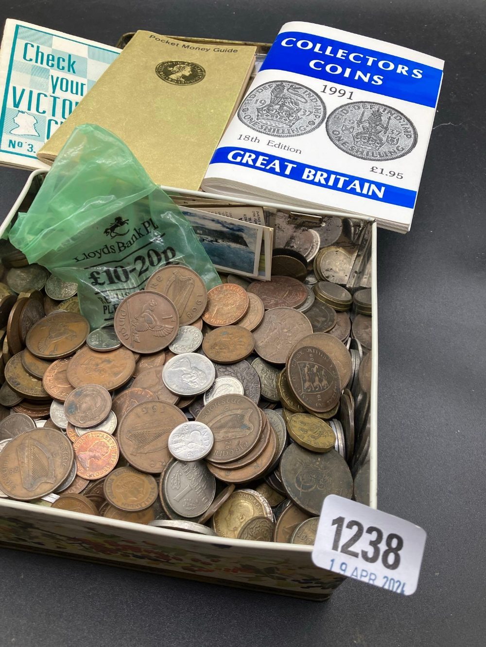 A tin of assorted coins