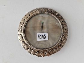 A late Victorian circular photo frame with unusual shamrock decorated border, 6 inches diameter,