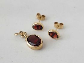 A pair of garnet set earrings and a pendant, 9ct, 2.7 g