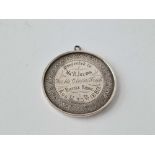 A silver large medal for bicycle riding for 1880 and inscribed for his clever trick, 2 inches