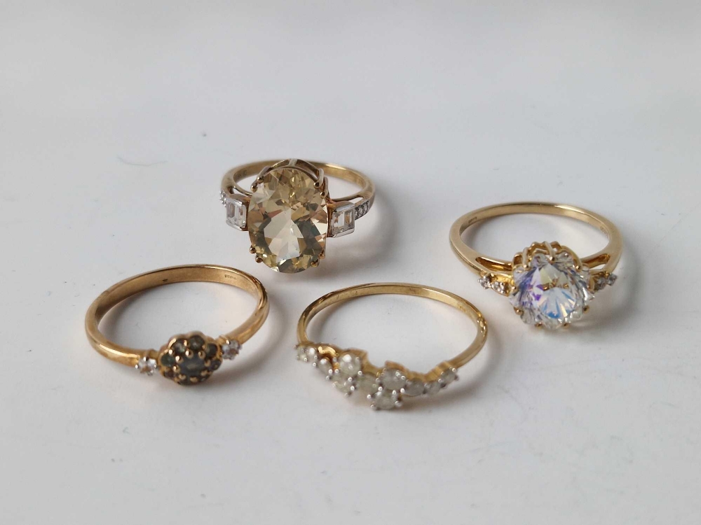 Four 9ct dress rings, 10.5 g inc